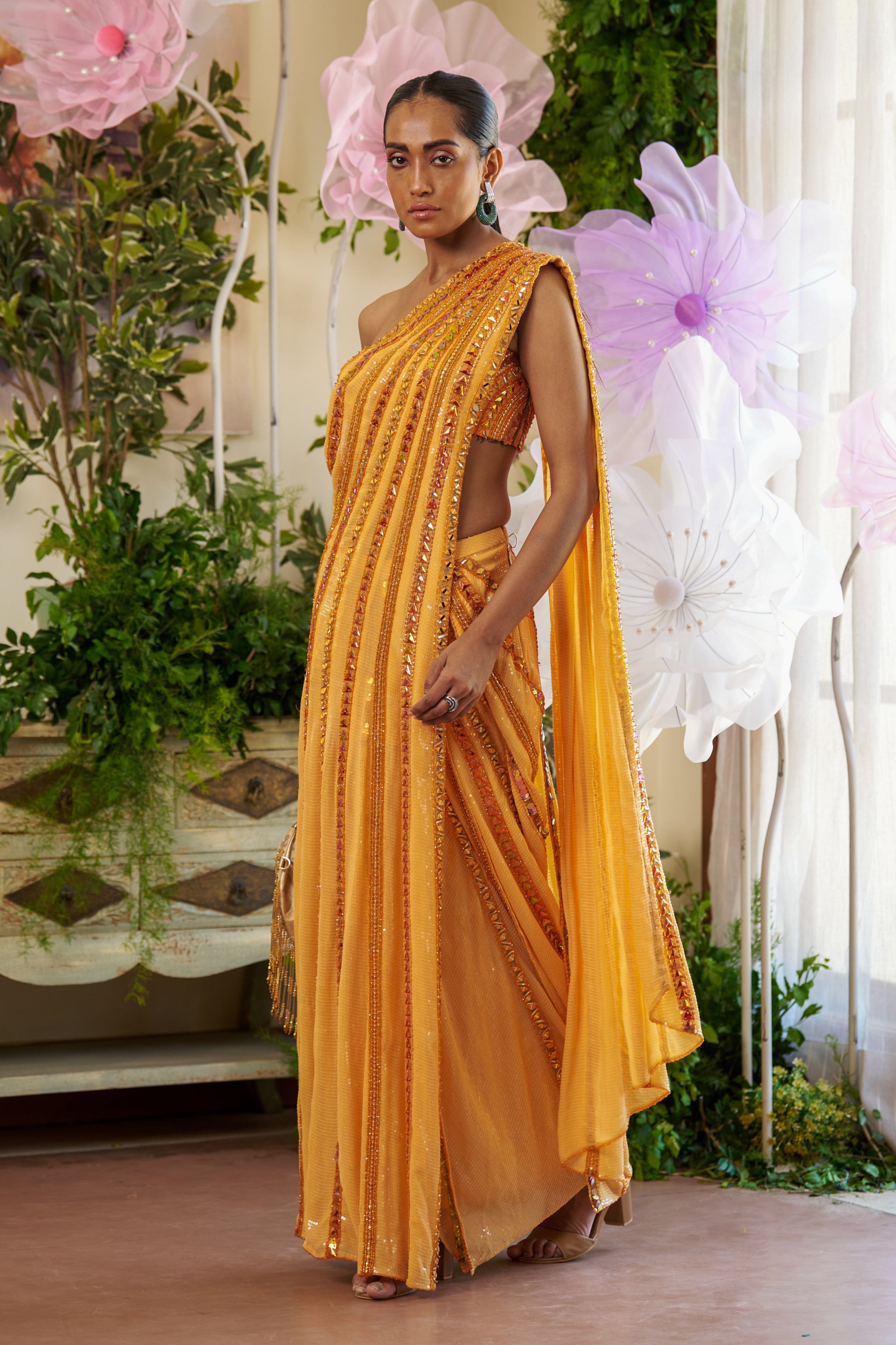 Dhoti-style wedding saree skirt with sequins and mirrorwork, designed for festive occasions.