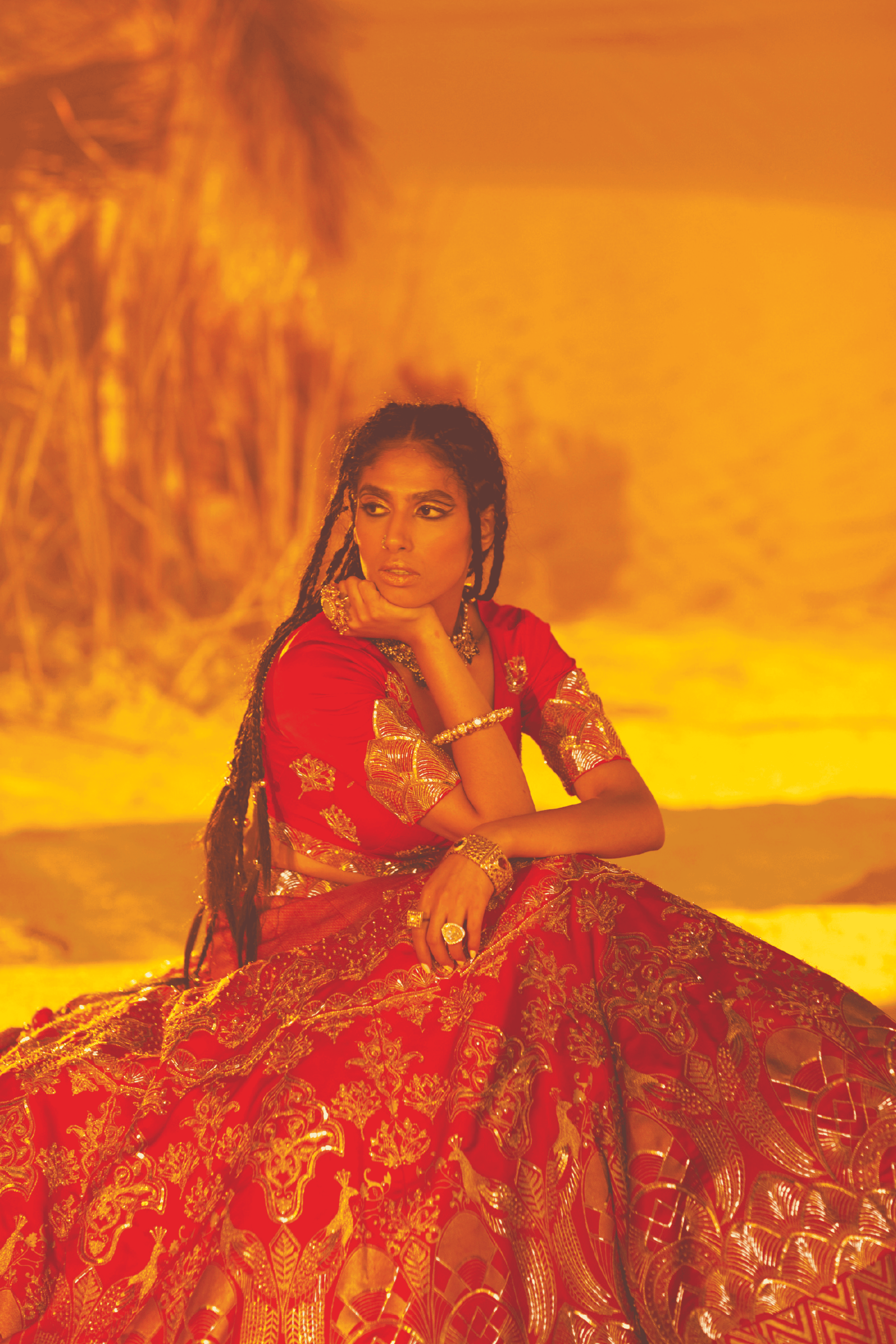 Red Layla Surkh Lehenga with intricate embroidery, floral gold print, and a structured V-neck blouse.
