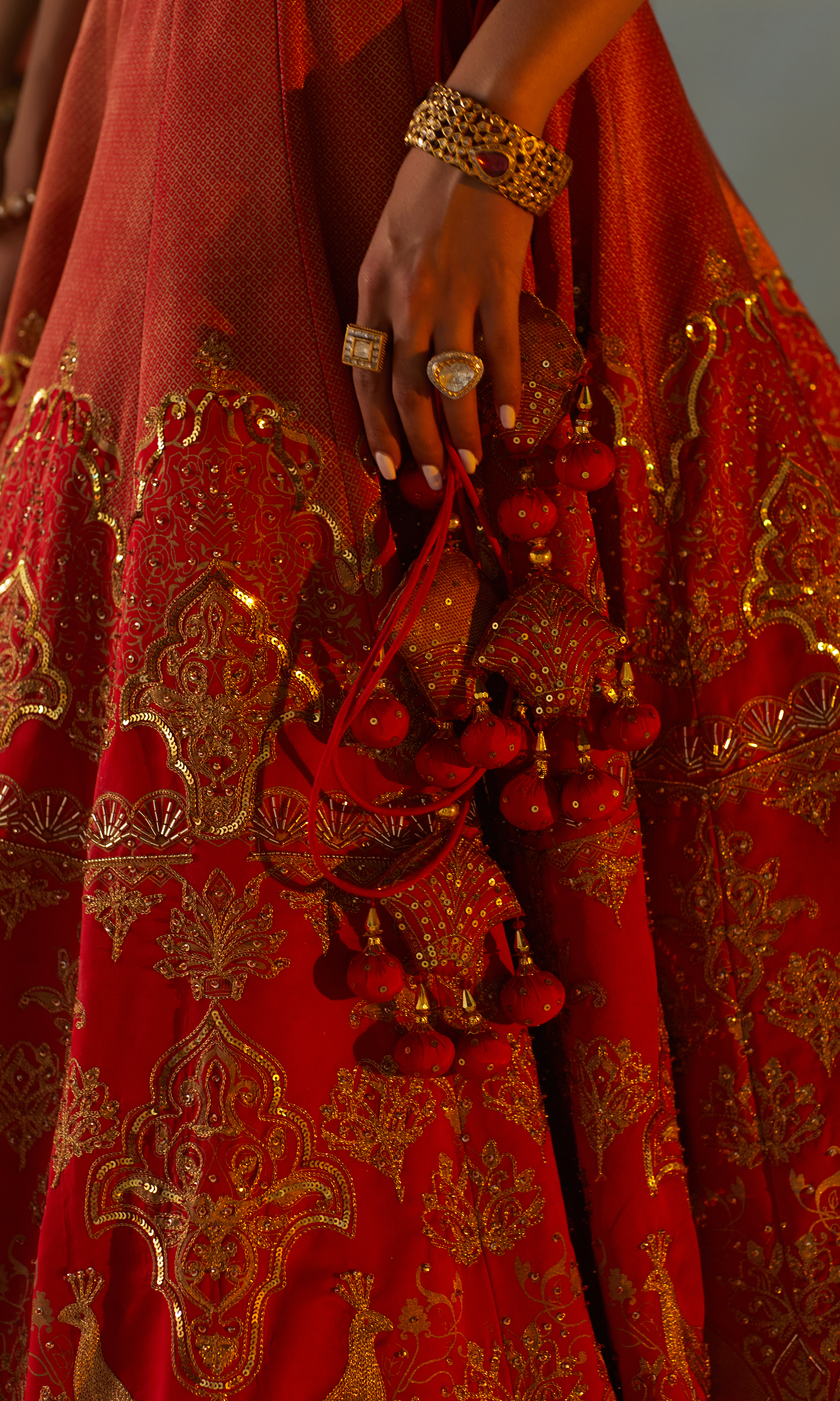 Modal satin lehenga paired with a sheer butterfly net dupatta for an elegant bridal look.