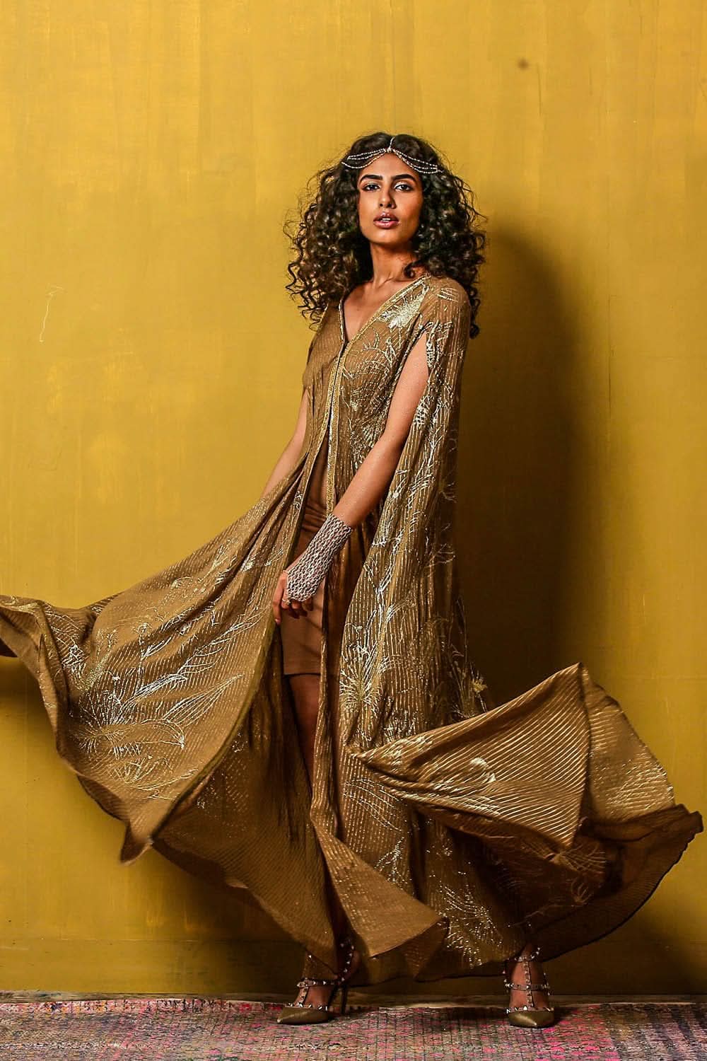 Highlighting the draped silhouette and intricate floral patterns.