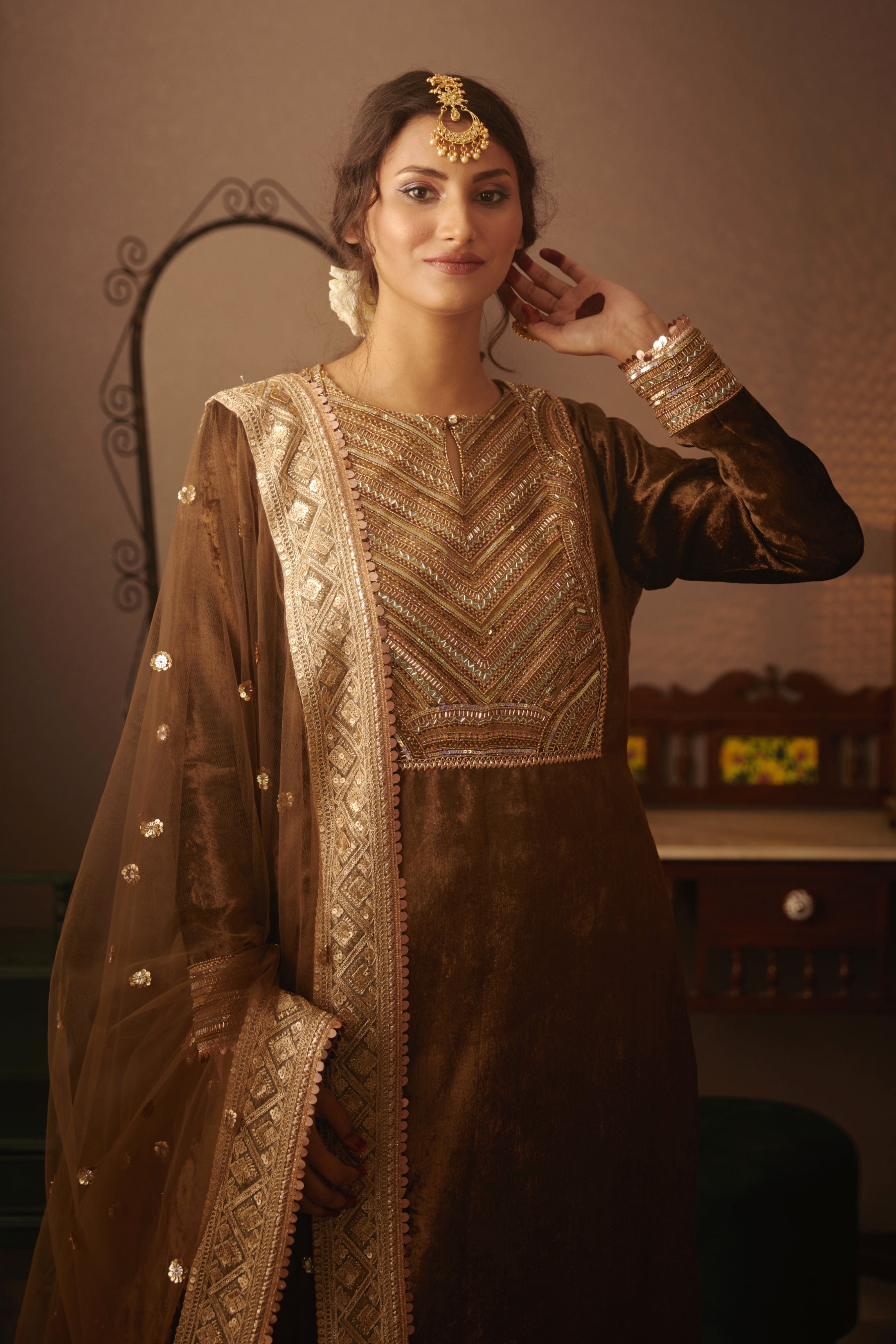 Embellished neck yoke and velvet detailing on designer Nora Kurta.