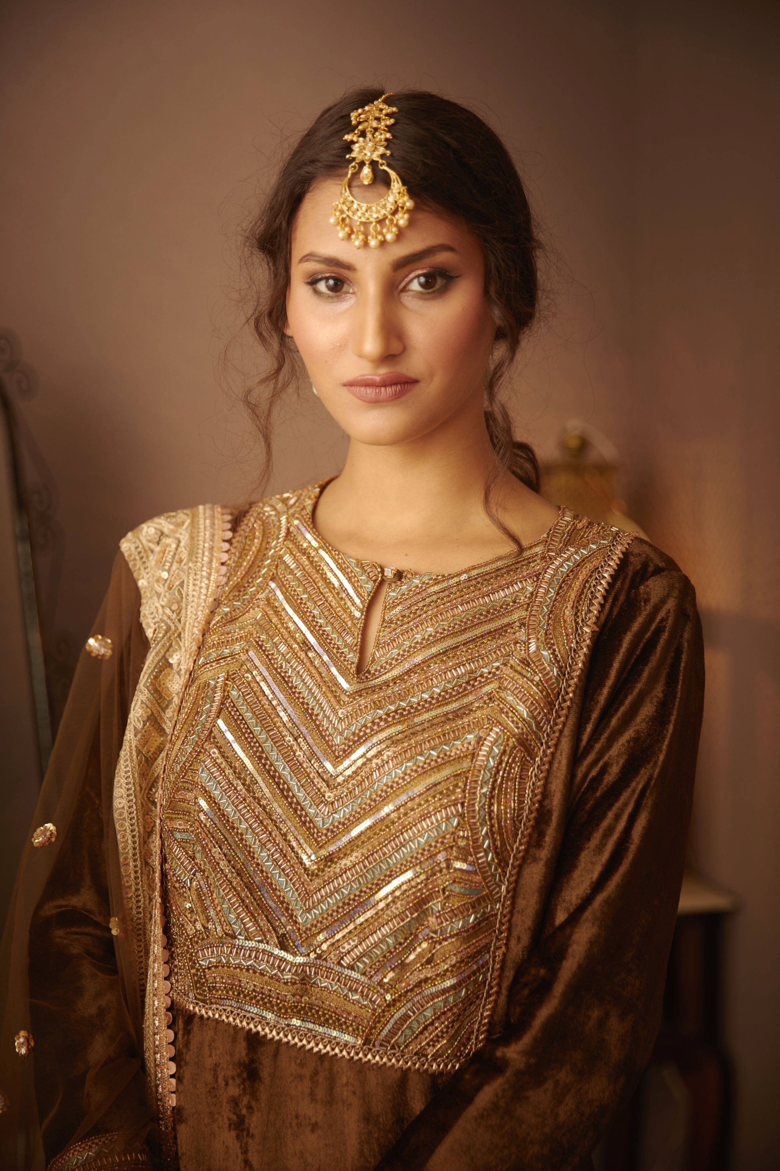 Close-up of intricate embellishments on the neck yoke of the Nora Kurta.