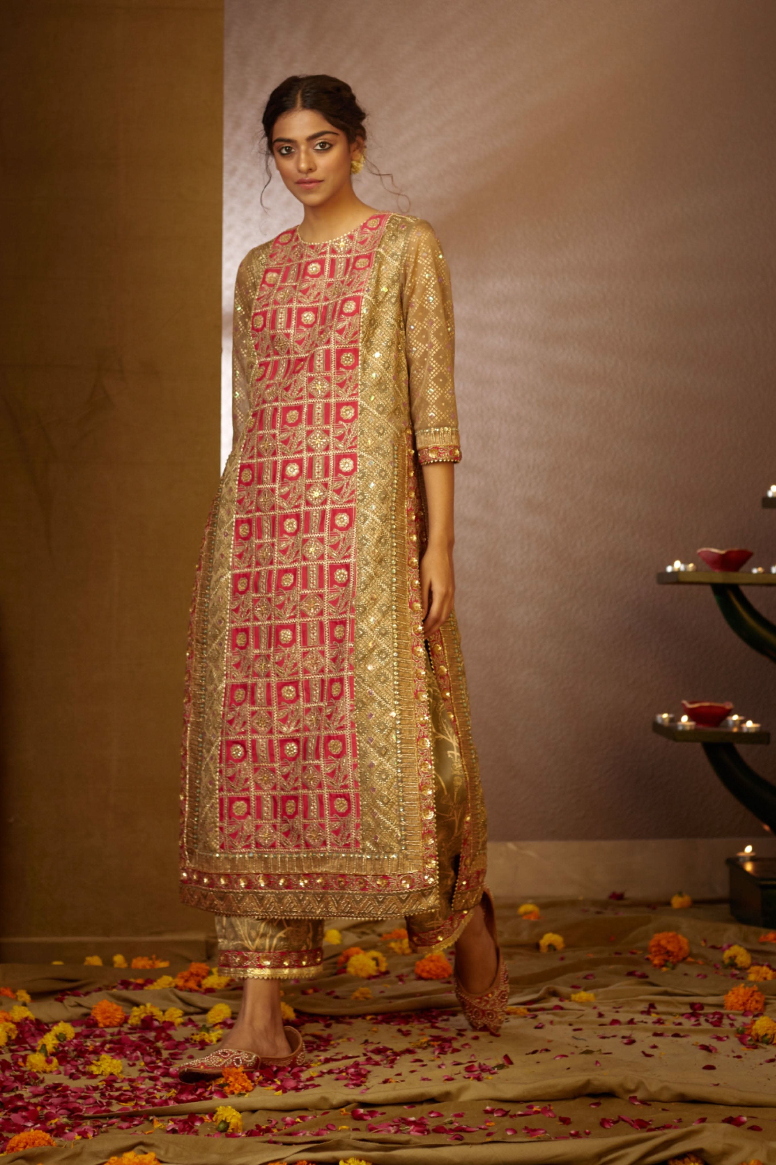 Vibrant Purvi Kurta Set by Moledro with bold paneling, intricate embellishments, and luxurious gold accents.