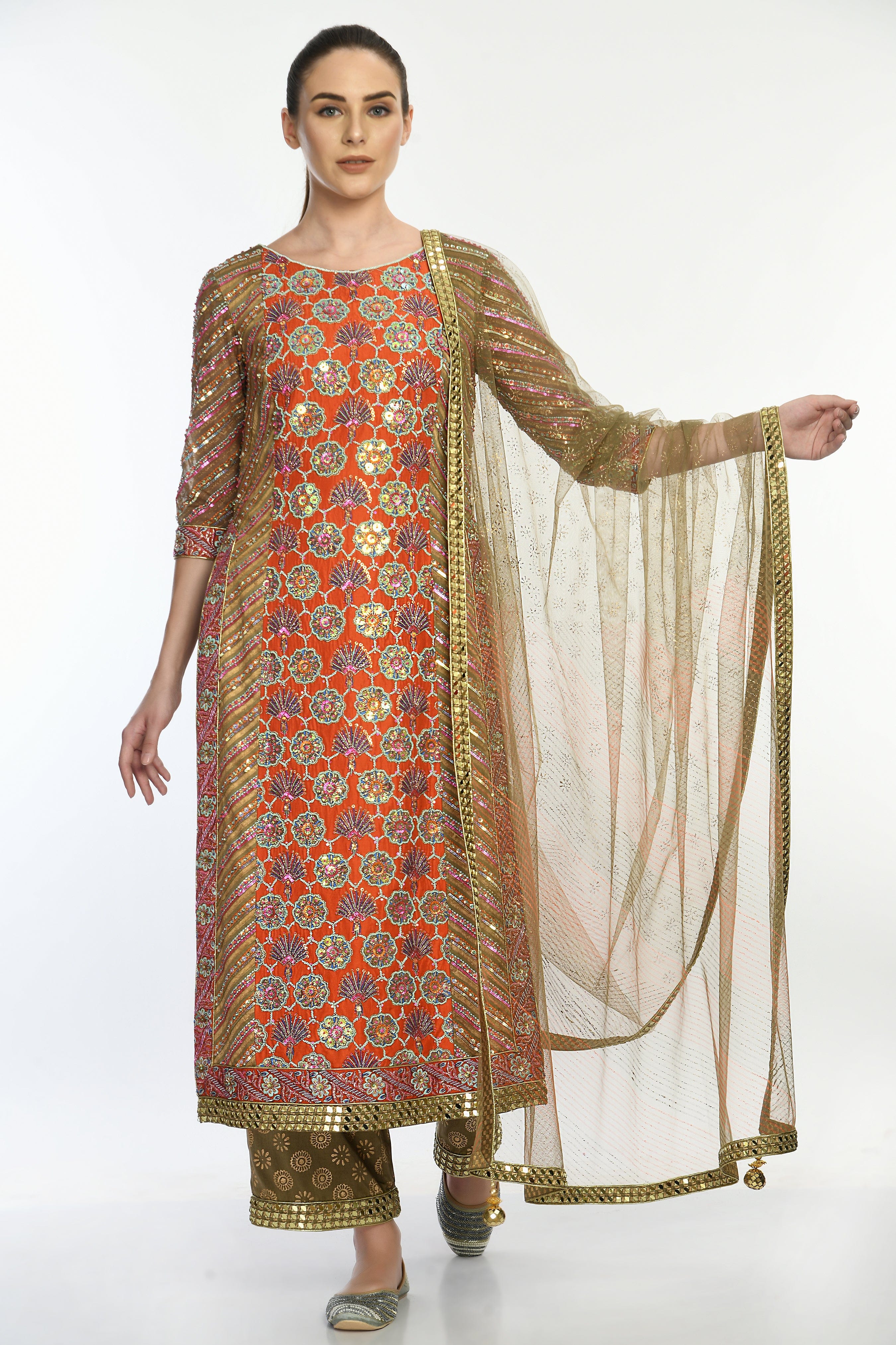 Sheer net dupatta with a mirrorwork border and handmade tassels, paired with the Saanjh Kurta Set.