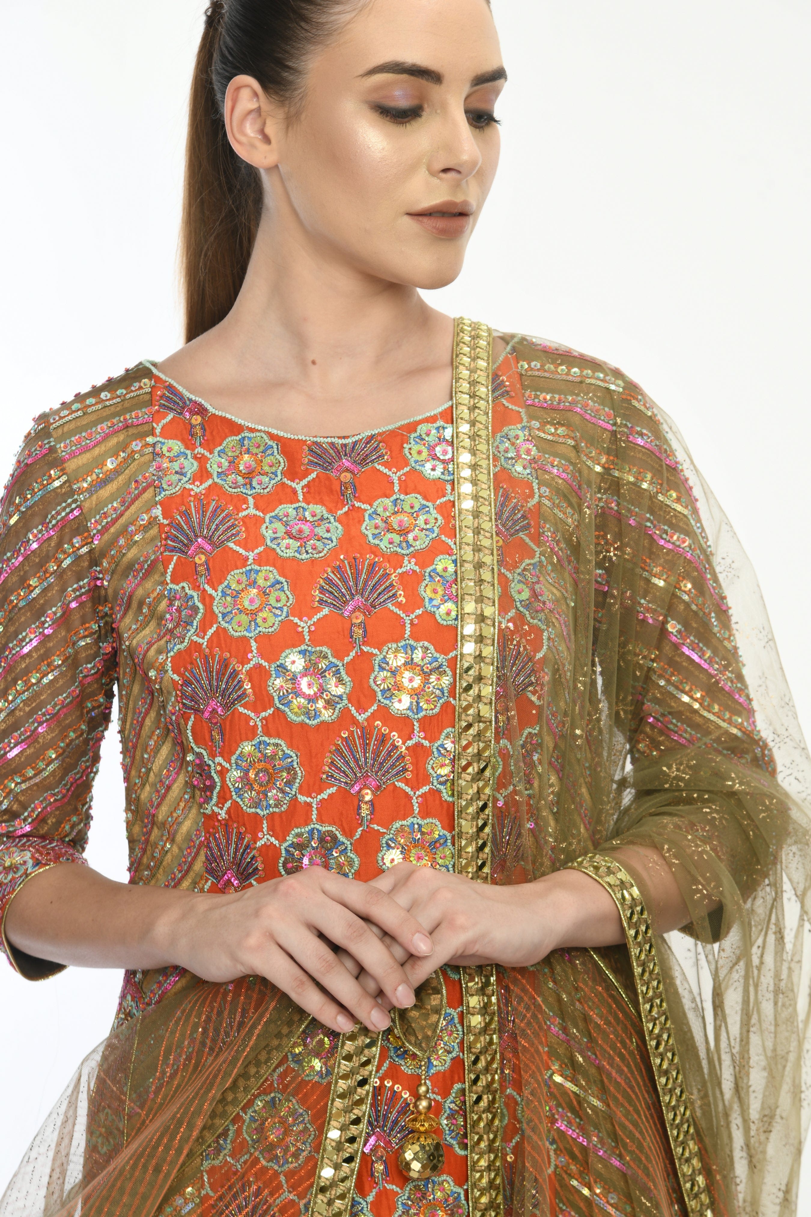 Close-up of the Saanjh Kurta highlighting floral embroidery, sequins, and beads on the opada silk fabric.