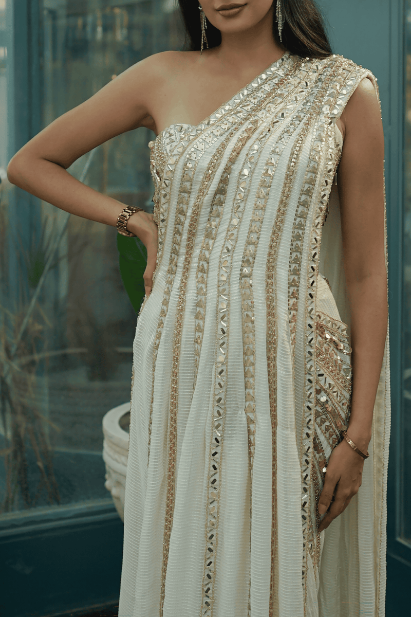 Stylish one-shoulder blouse with intricate beadwork and a metal zip closure for a modern wedding saree.