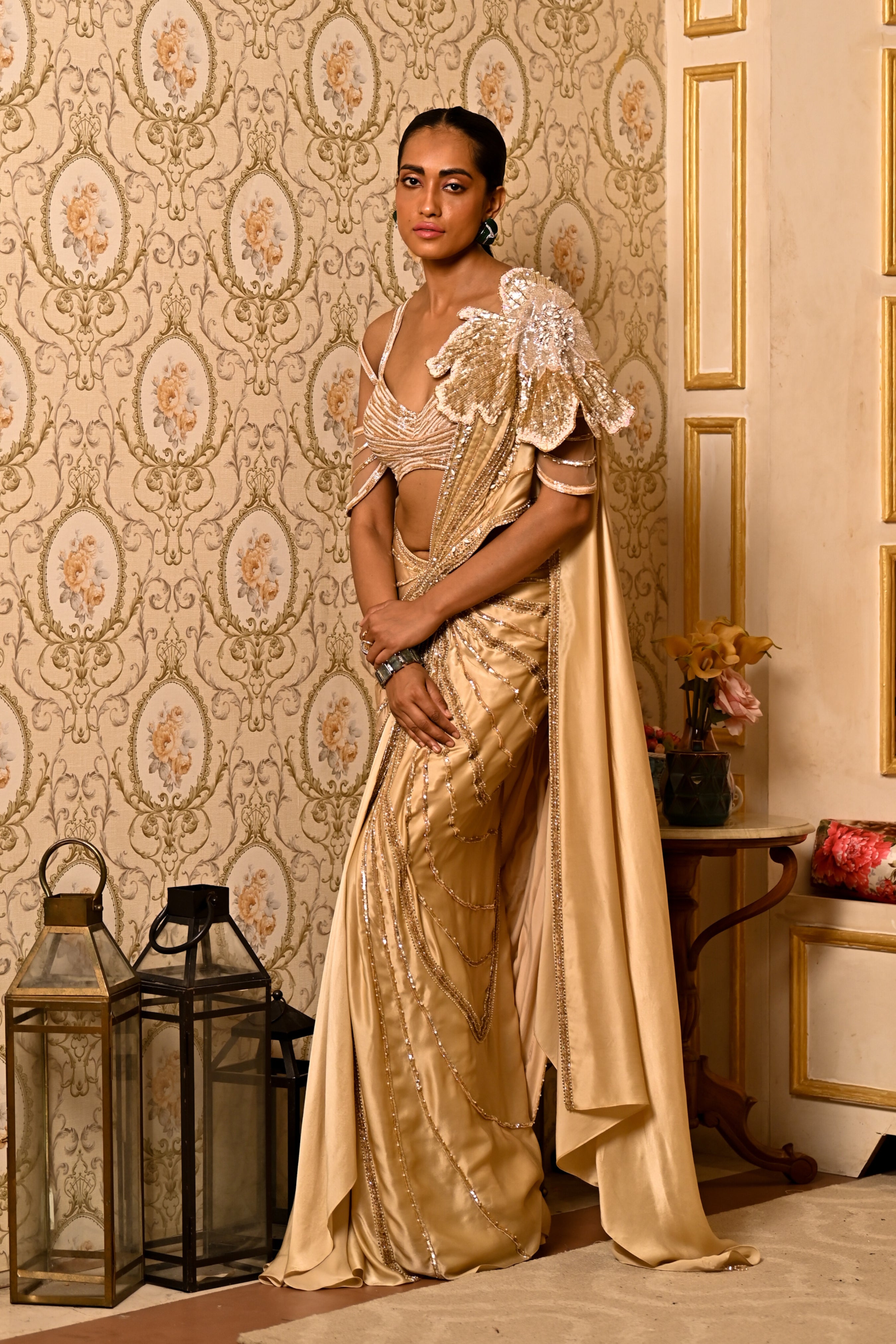 Leia Pre-Draped Saree by Moledro in gold with floral applique and beadwork, ideal for weddings.