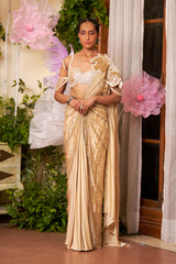 Delhi Designer Saree combining modern cold shoulder styling with traditional applique details for UAE celebrations.