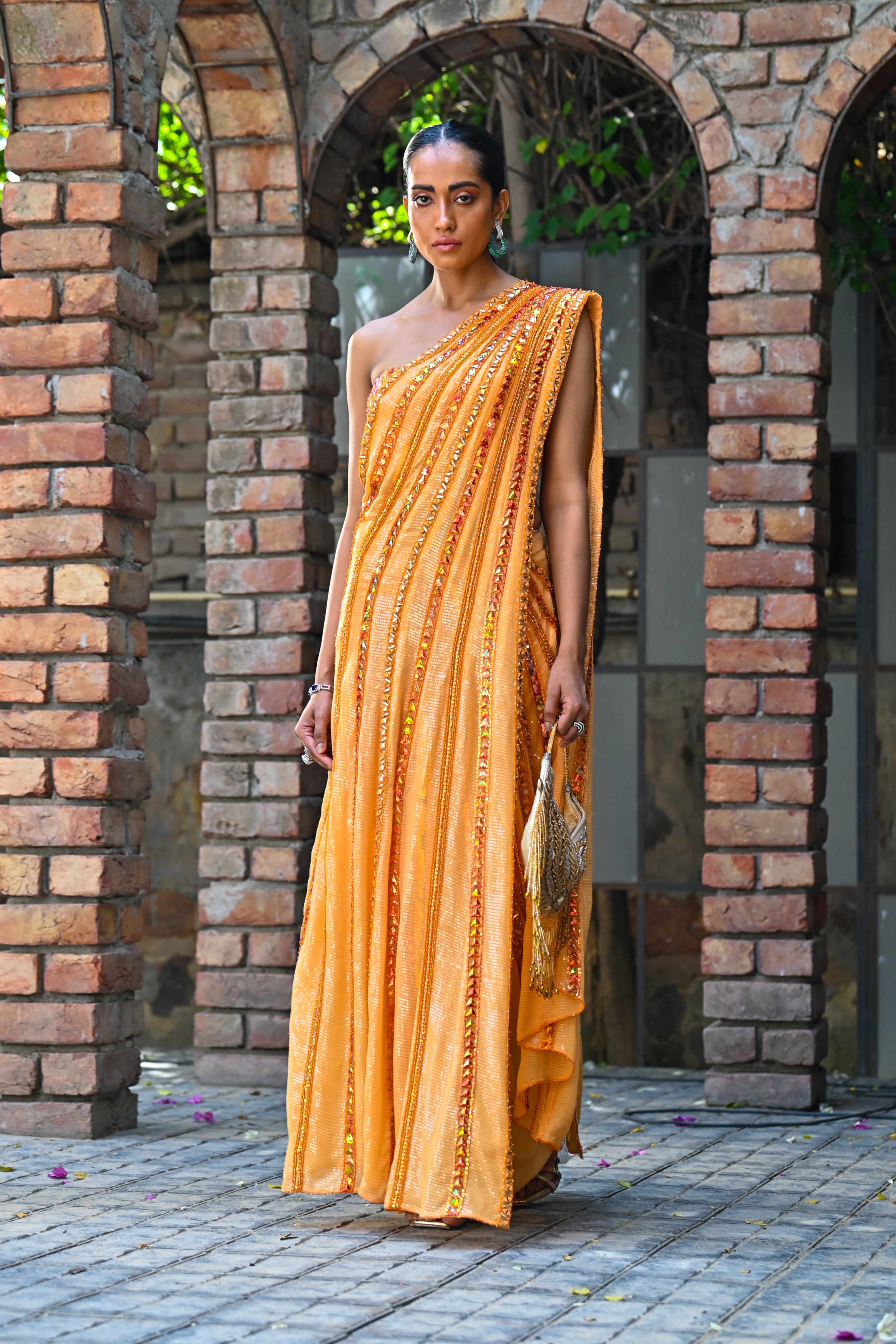 Zia Pre-Draped Saree with a sequined dhoti-style skirt and mirror-embellished one-shoulder blouse, perfect for Dubai weddings.