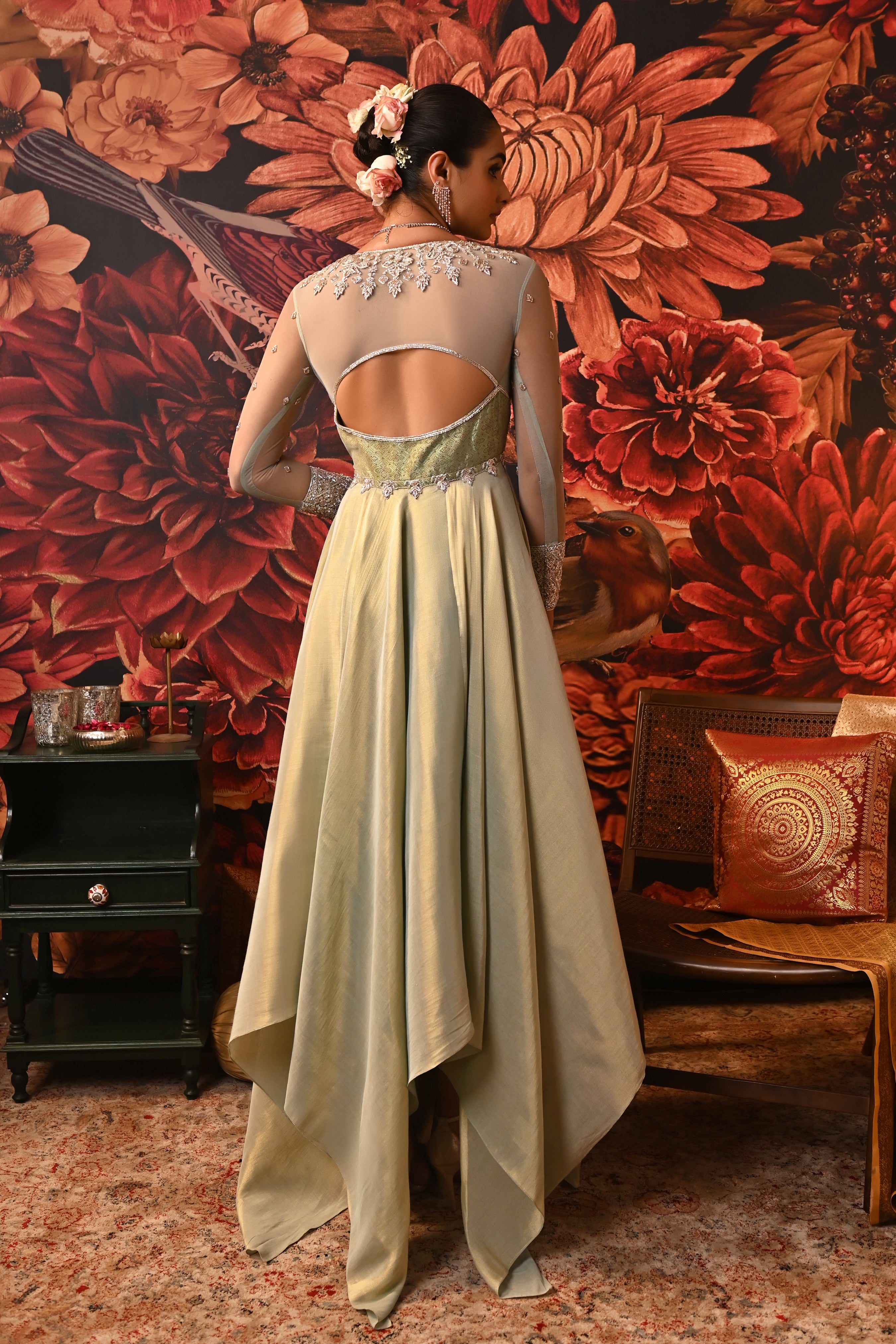 Full-length Anarkali with sheer net sleeves, structured back, and a detailed embroidered cuff.