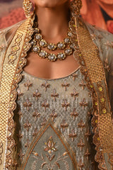 Close-up of the pista green kurta with intricate dabka embroidery, golden highlights, and embroidered cuffs by Moledro.