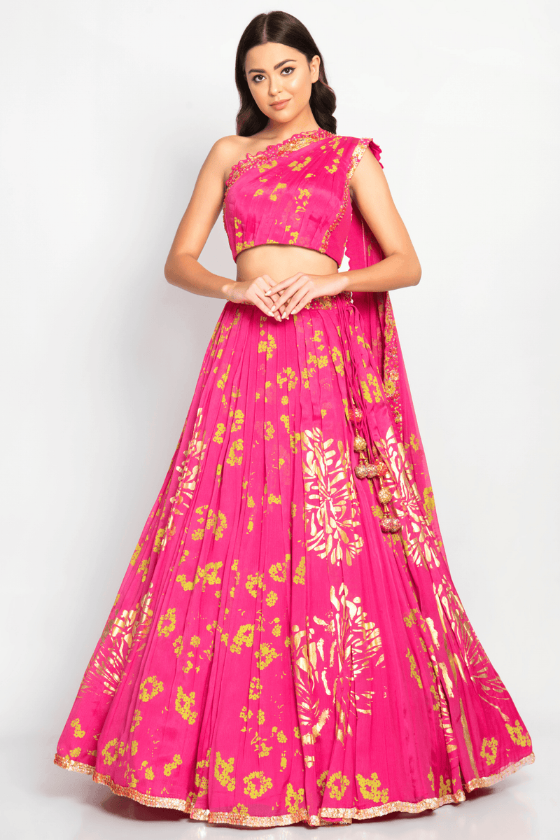 Stylish Humaira Lehenga Set with floral motifs and a one-shoulder blouse in a pink shade.