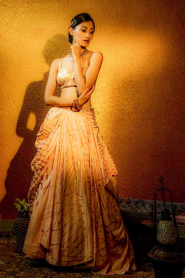 Flowing draped skirt designed with gold and copper foil work for a modern ethnic look.