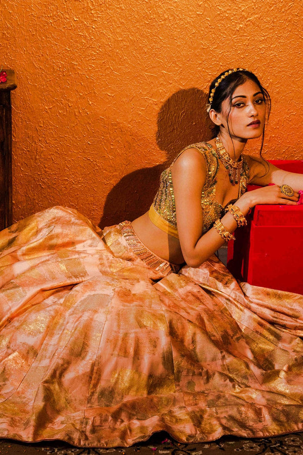 Beaded waist belt designed to complement the gold foil work on the lehenga.