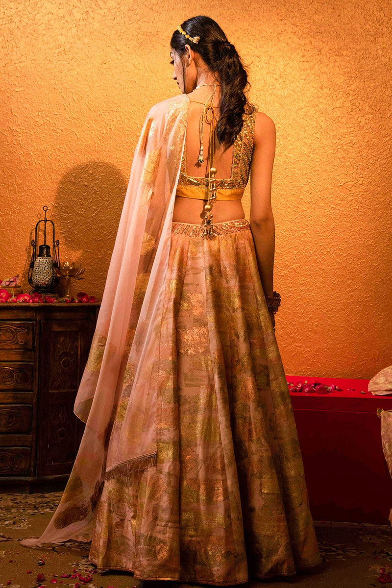 Hya Lehenga crafted with handmade tassels and sleeveless blouse.