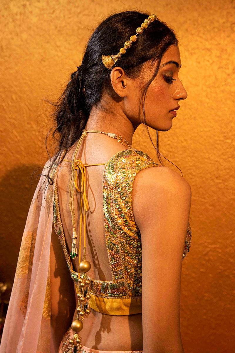 Intricate sequin detailing on the sleeveless blouse paired with the Hya Lehenga.