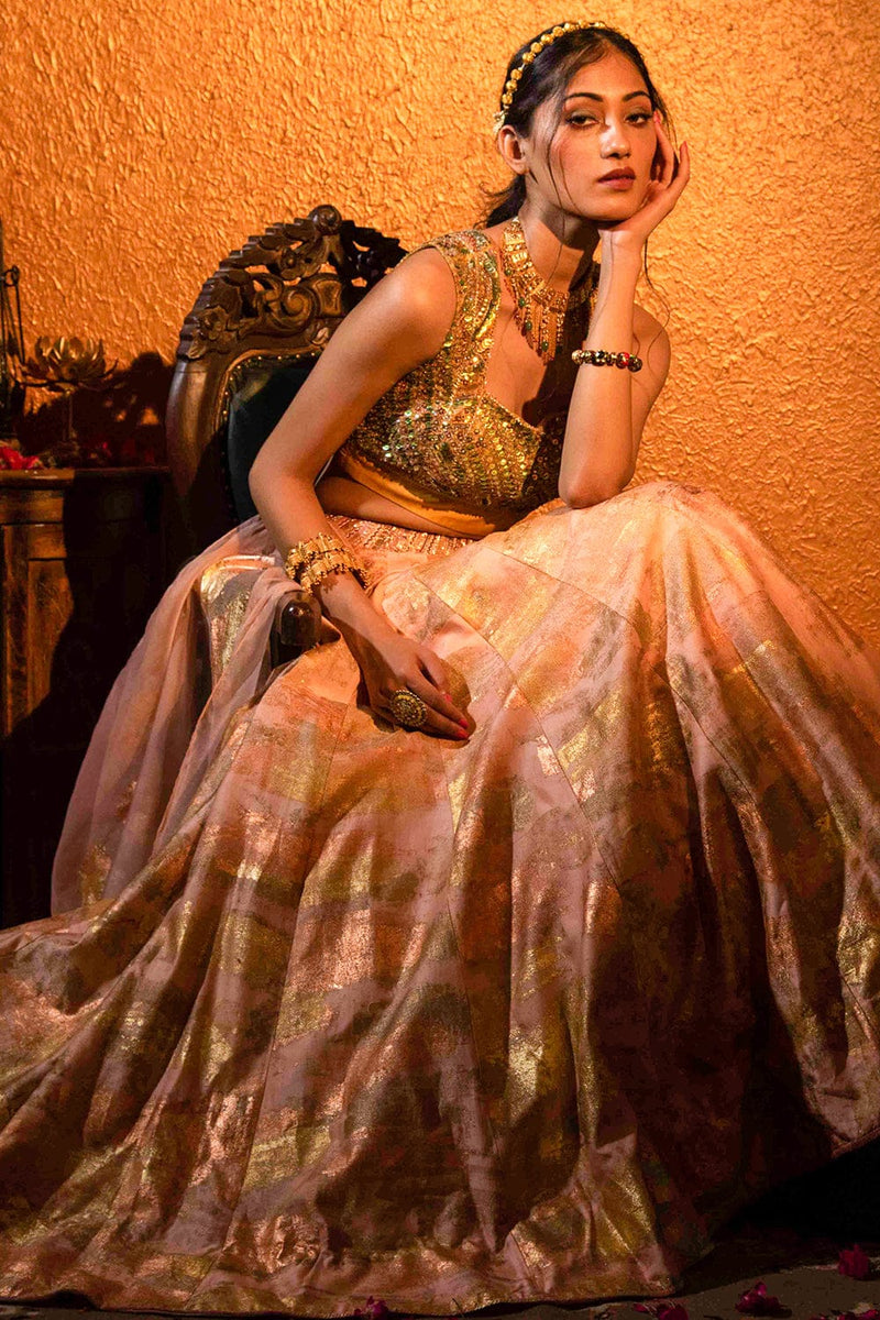 Hya Lehenga Set with a sequined blouse, gold foil lehenga, and organza dupatta featuring fringed lace.
