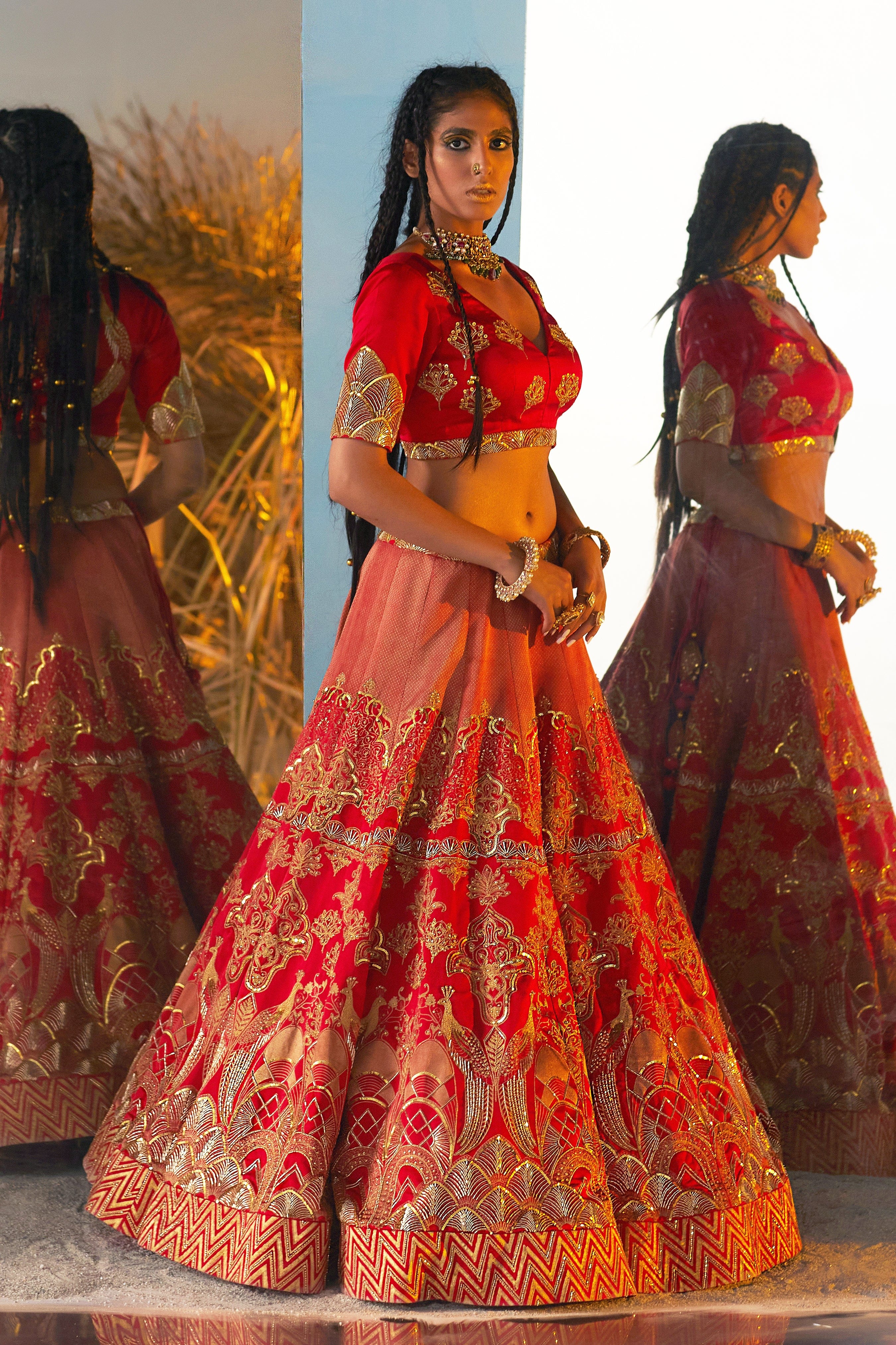 Layla Surkh Lehenga in red with gold printing, hand embroidery, and a V-neck blouse, designed by Moledro for luxury weddings in Dubai UAE.