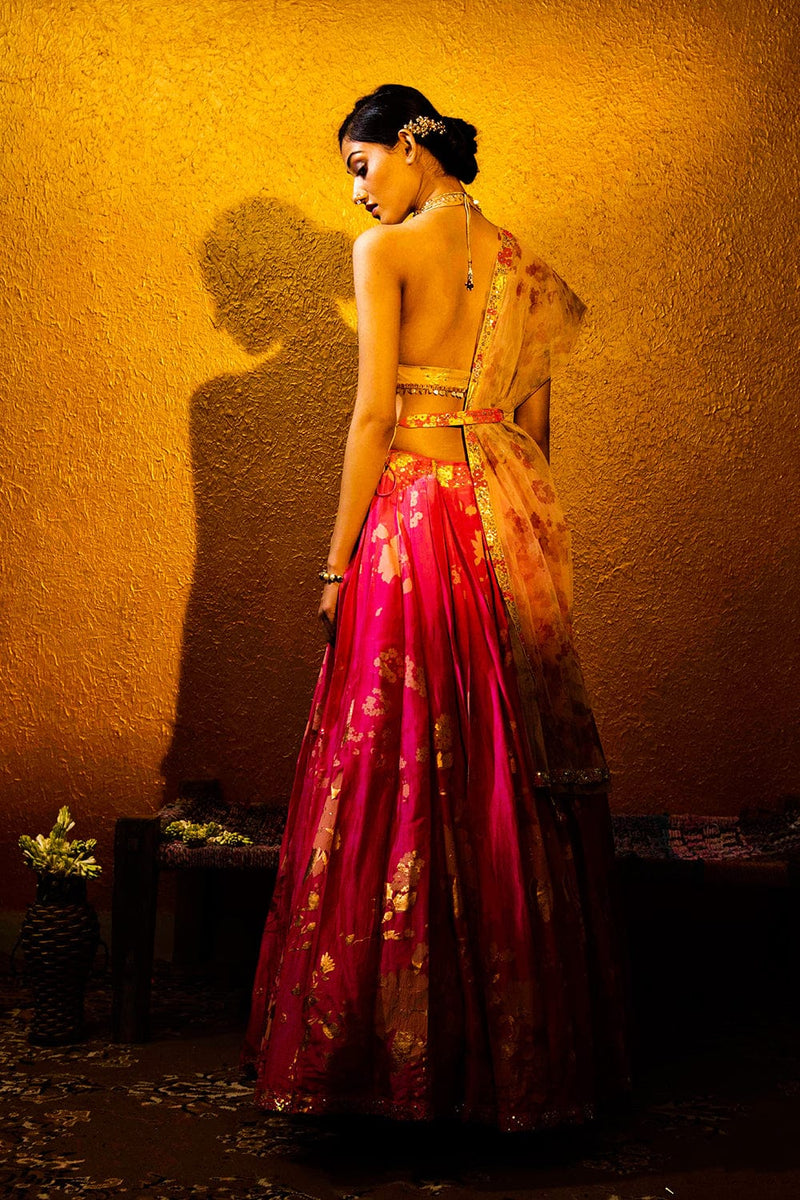 Halter neck blouse’s button closure and decorative tassels. Designer wear for women handcrafted by Moledro.