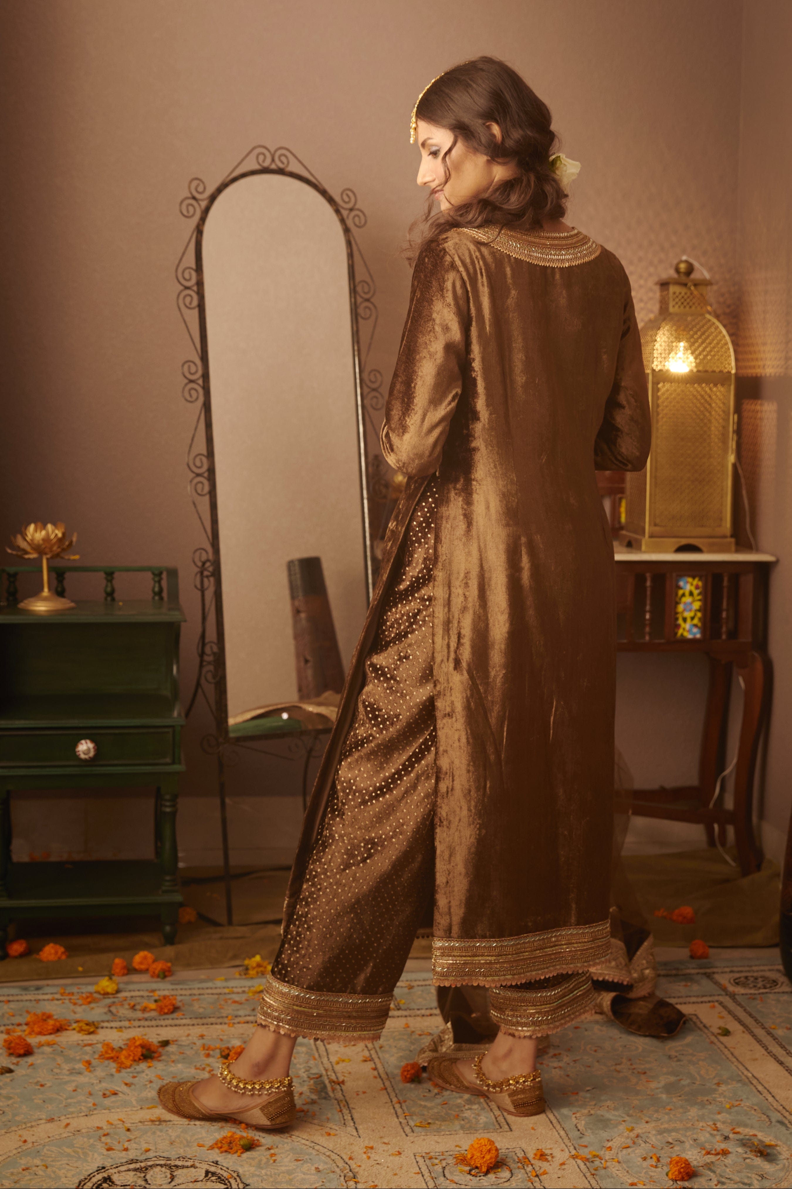 Back view of Nora Kurta showcasing the elegant velvet fabric and tailored design by Moledro.