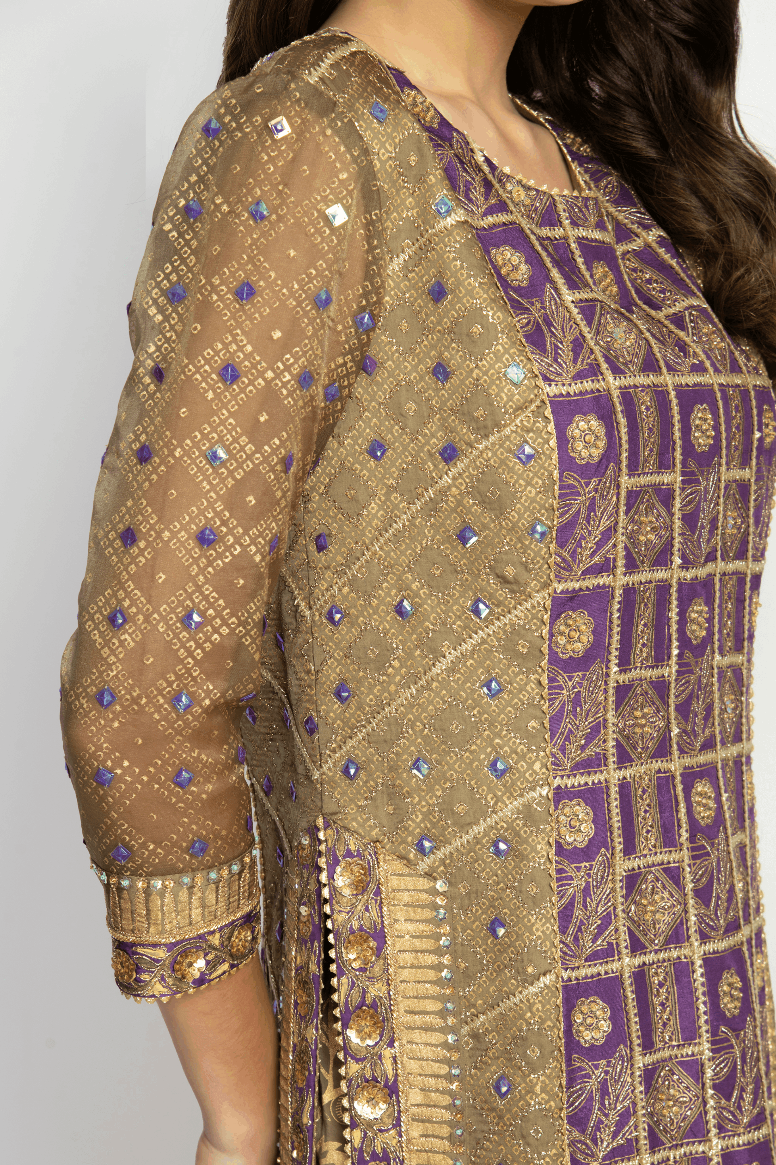 Close-up of the embellished sleeves on the bridal kurta, showcasing intricate beadwork and fine detailing.