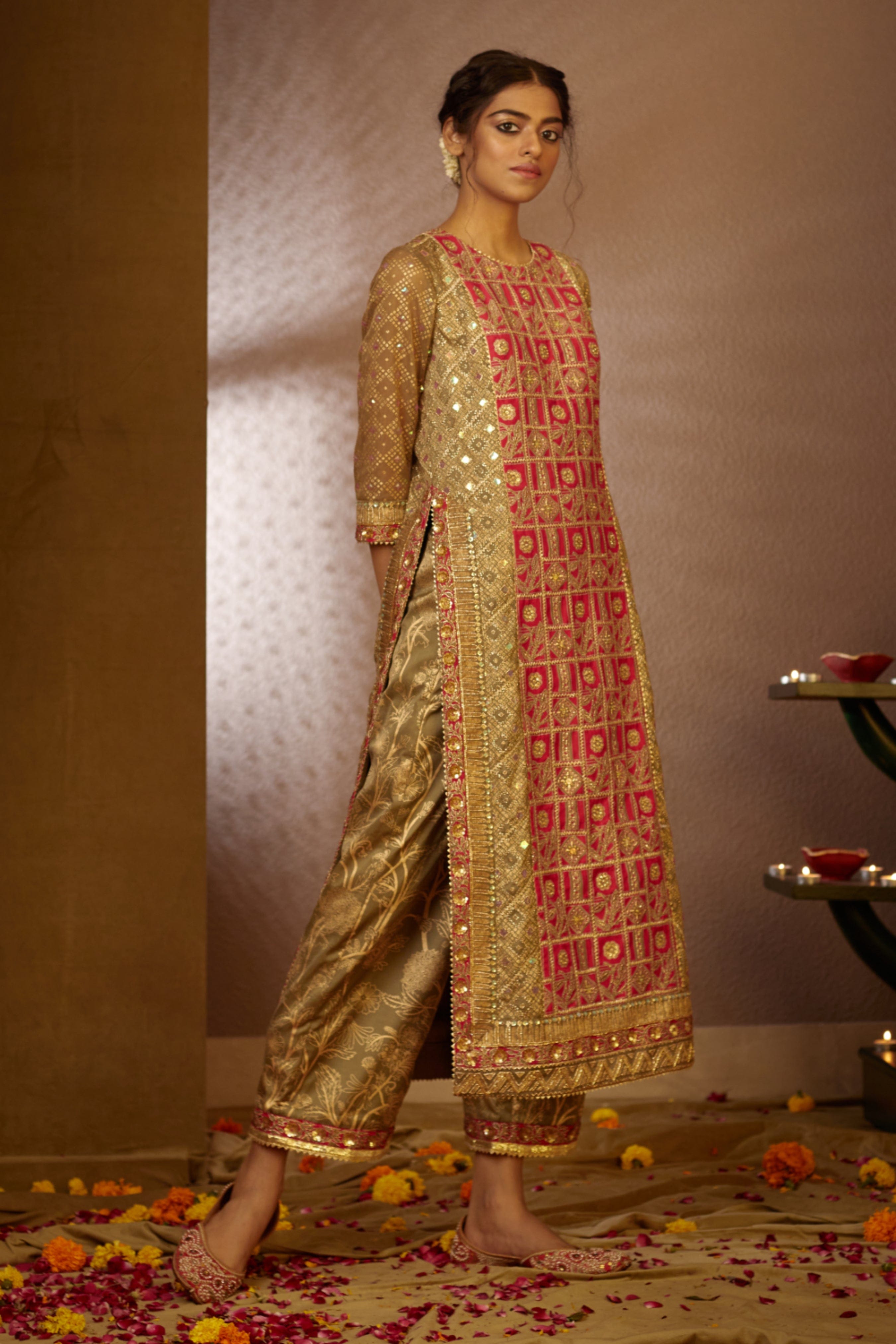 Intricate beadwork and shimmering sequins adorn the front of the Purvi Kurta, elevating its festive appeal.