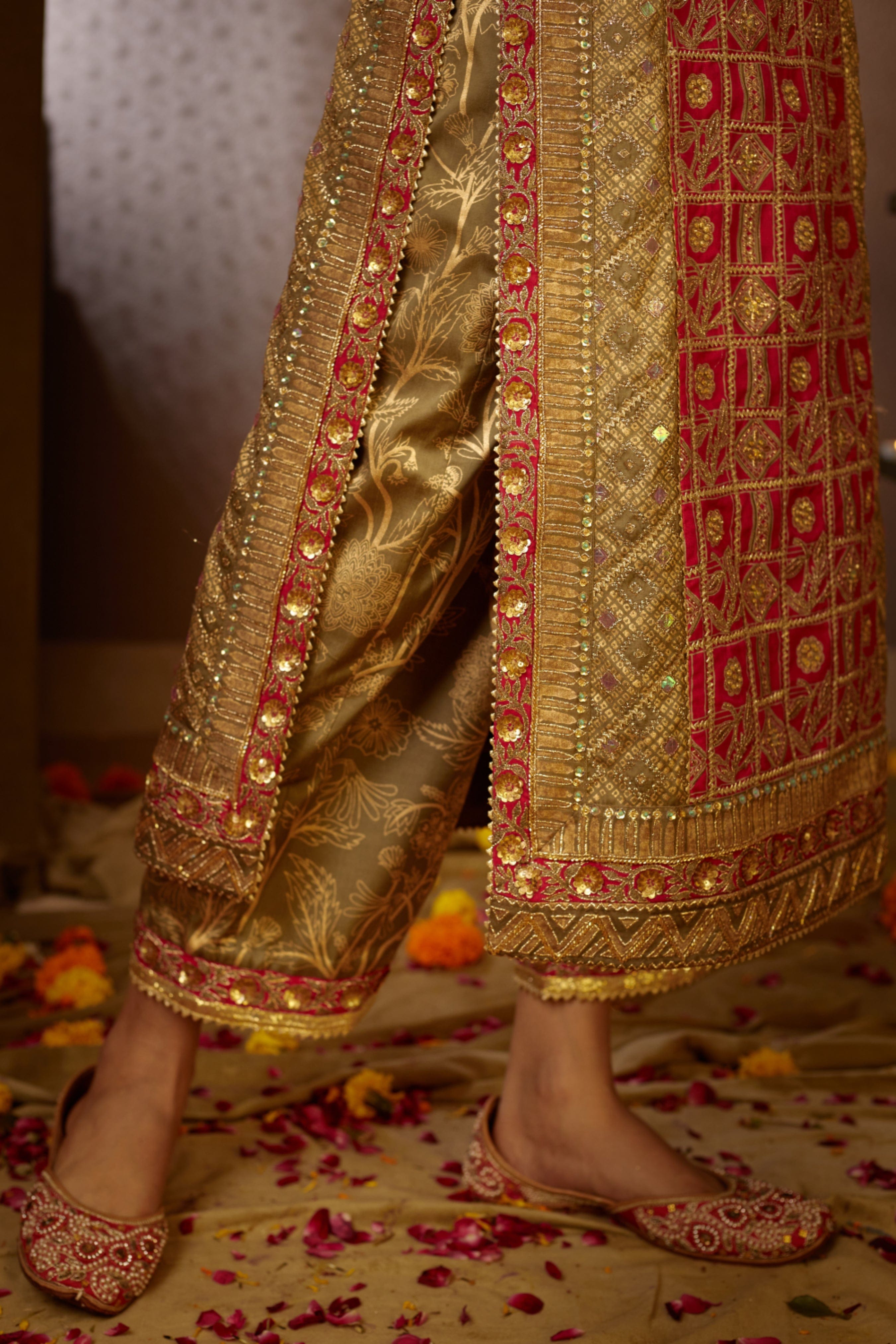 Lustrous pants with golden textured patterns, adding a modern touch to this ethnic ensemble.
