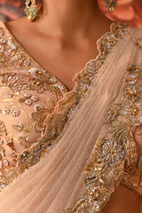 Silk organza blouse adorned with floral embroidery and zari brocade for a Shahpur Jat-inspired saree.
