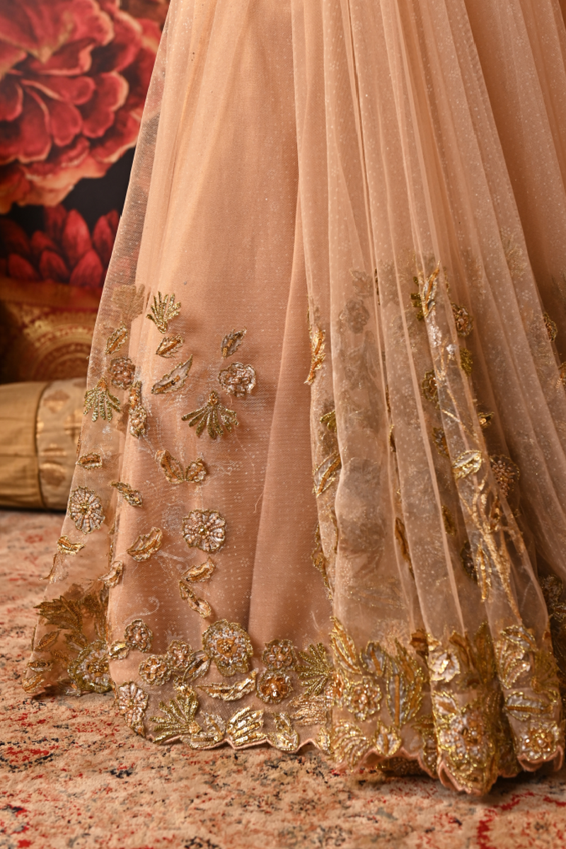 Pre-draped fishcut saree skirt with embroidered lower panels and side zip closure.