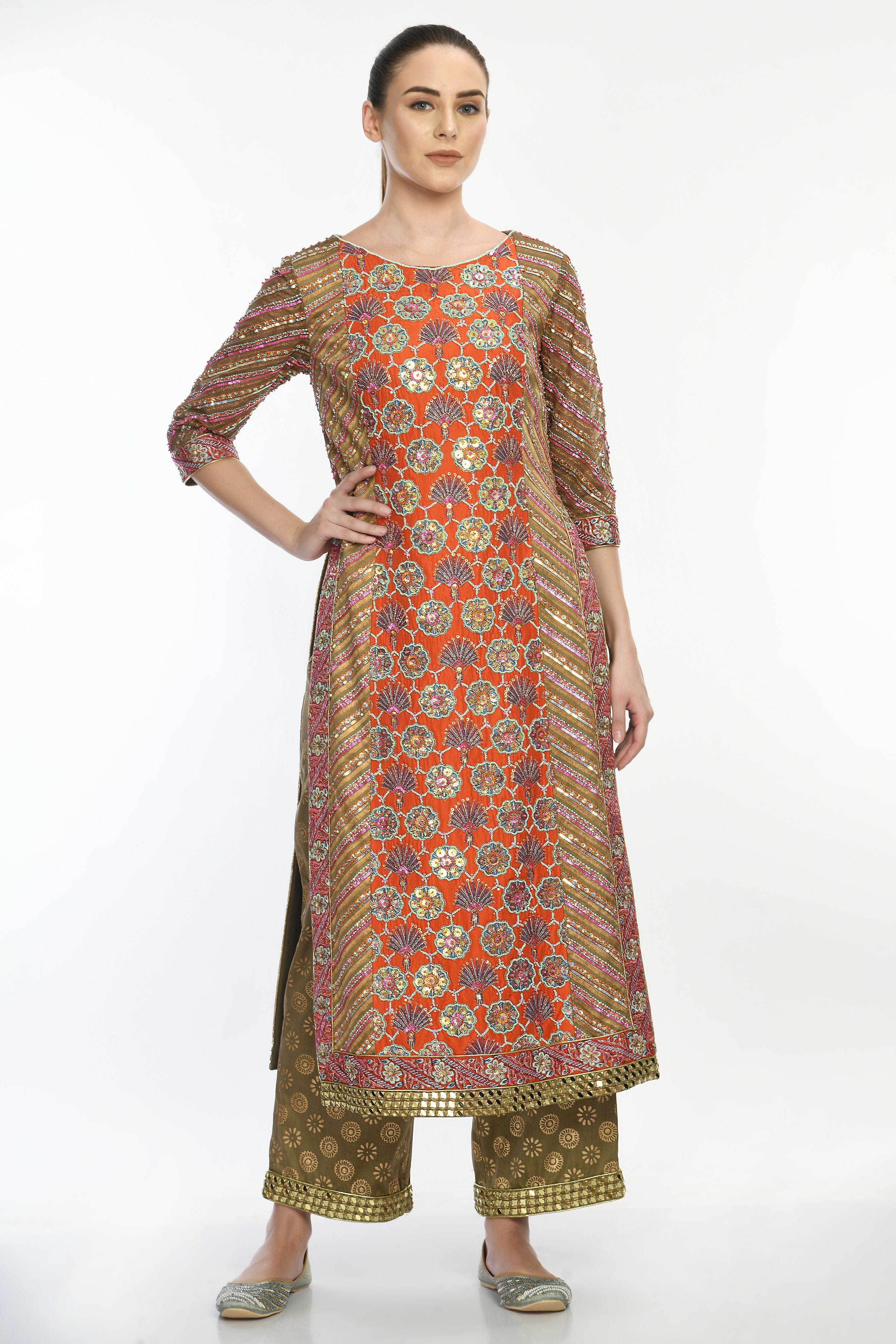 Saanjh Kurta Set by Moledro with floral embroidery, sequins, and mirrorwork on a long kurta, paired with gold-printed pants and a net dupatta.