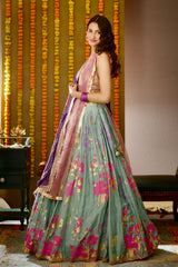 Side profile of Ula Lehenga set powder blue lehenga choli with pink dupatta.